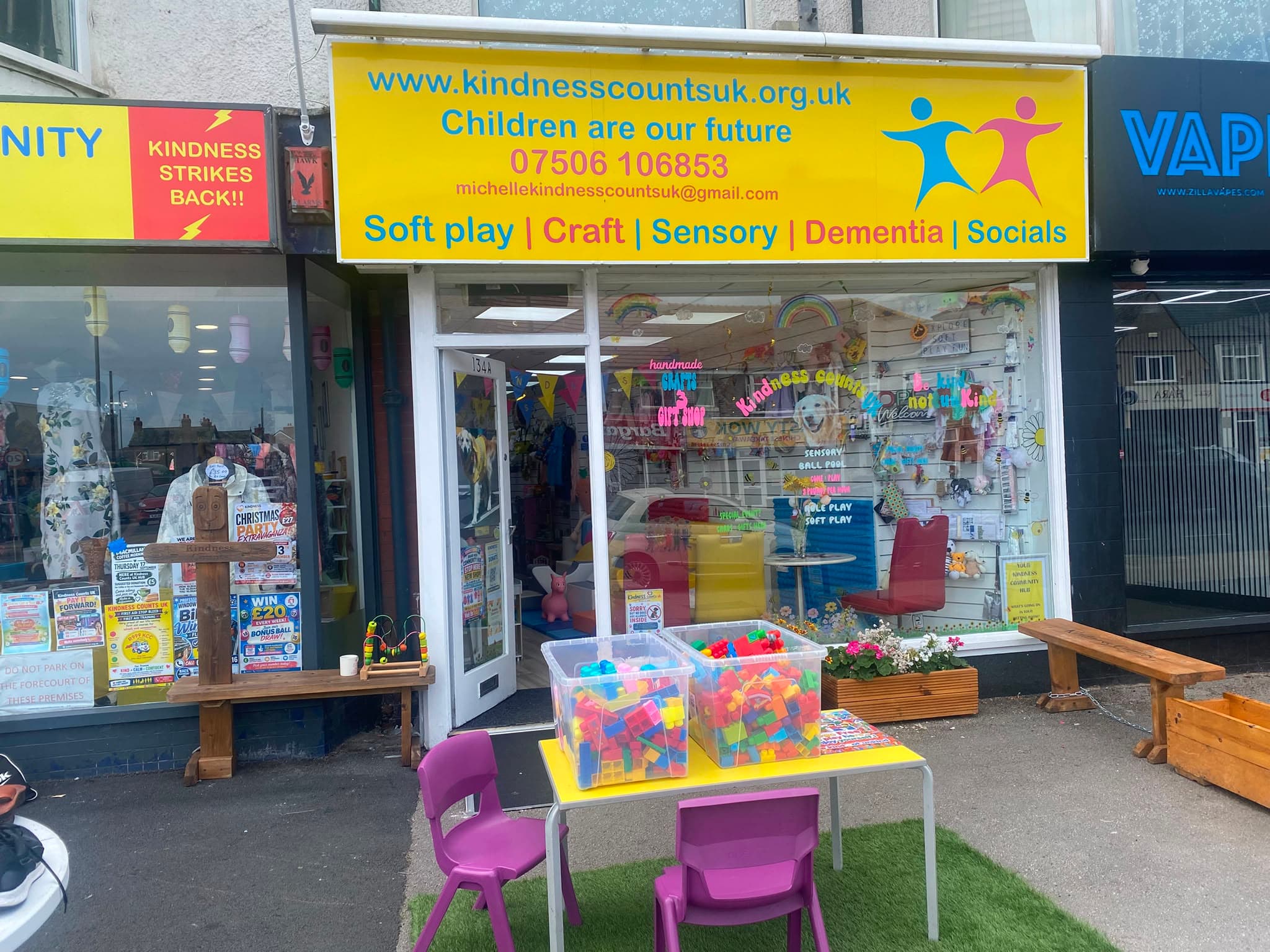 The Hub 3 shopfront, its yellow sign reading 'Children are our future' above a window advertising soft play and craft.