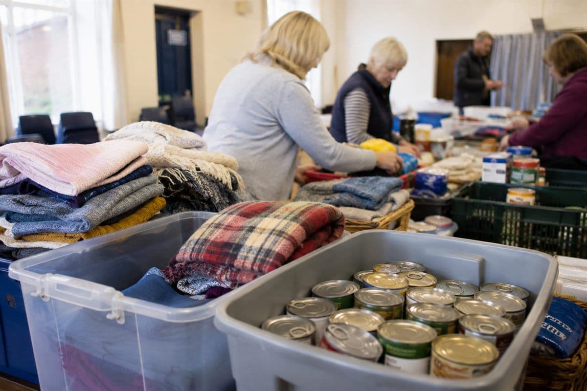 Donated clothing and food sorted into collection buckets at the hub.